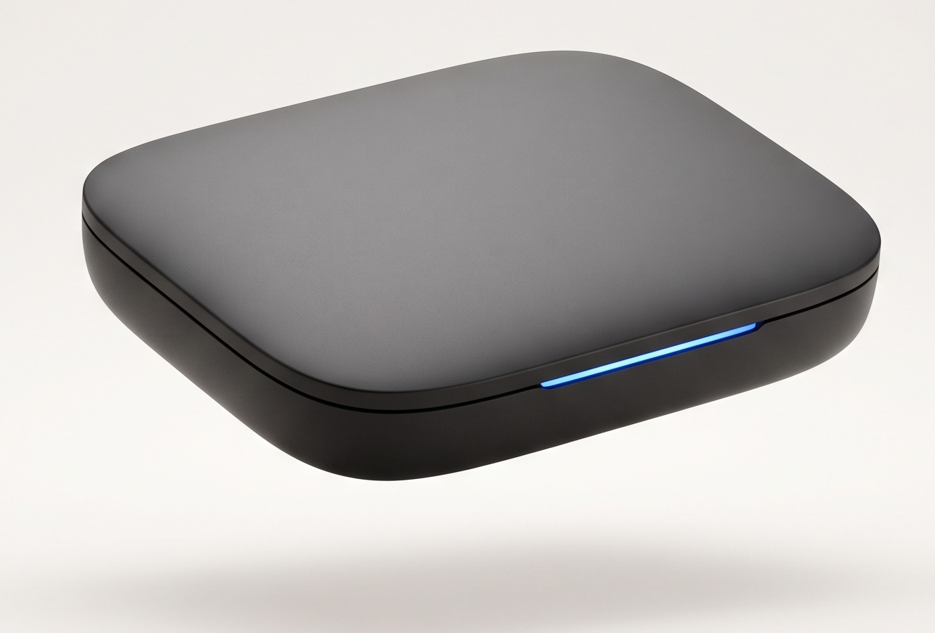 The CYSTEMS operating layer — a matte-charcoal device with a single electric-blue light seam, floating on a soft studio surface.